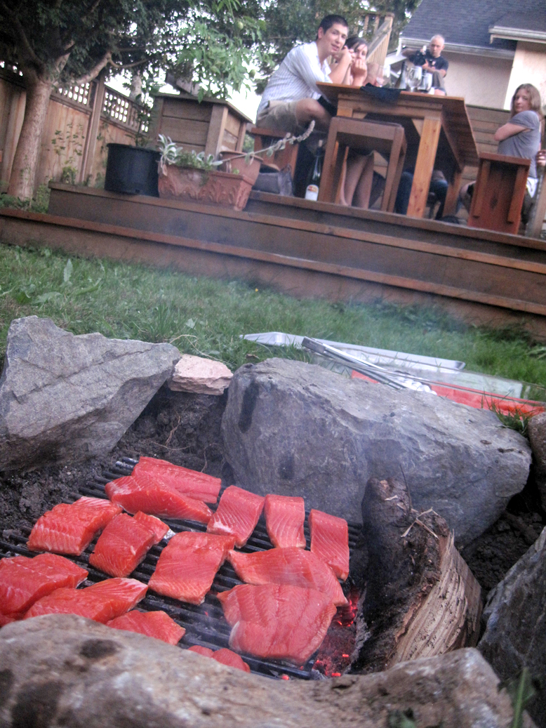a group of people sitting on a rock