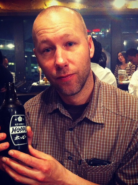 a man holding a glass of wine