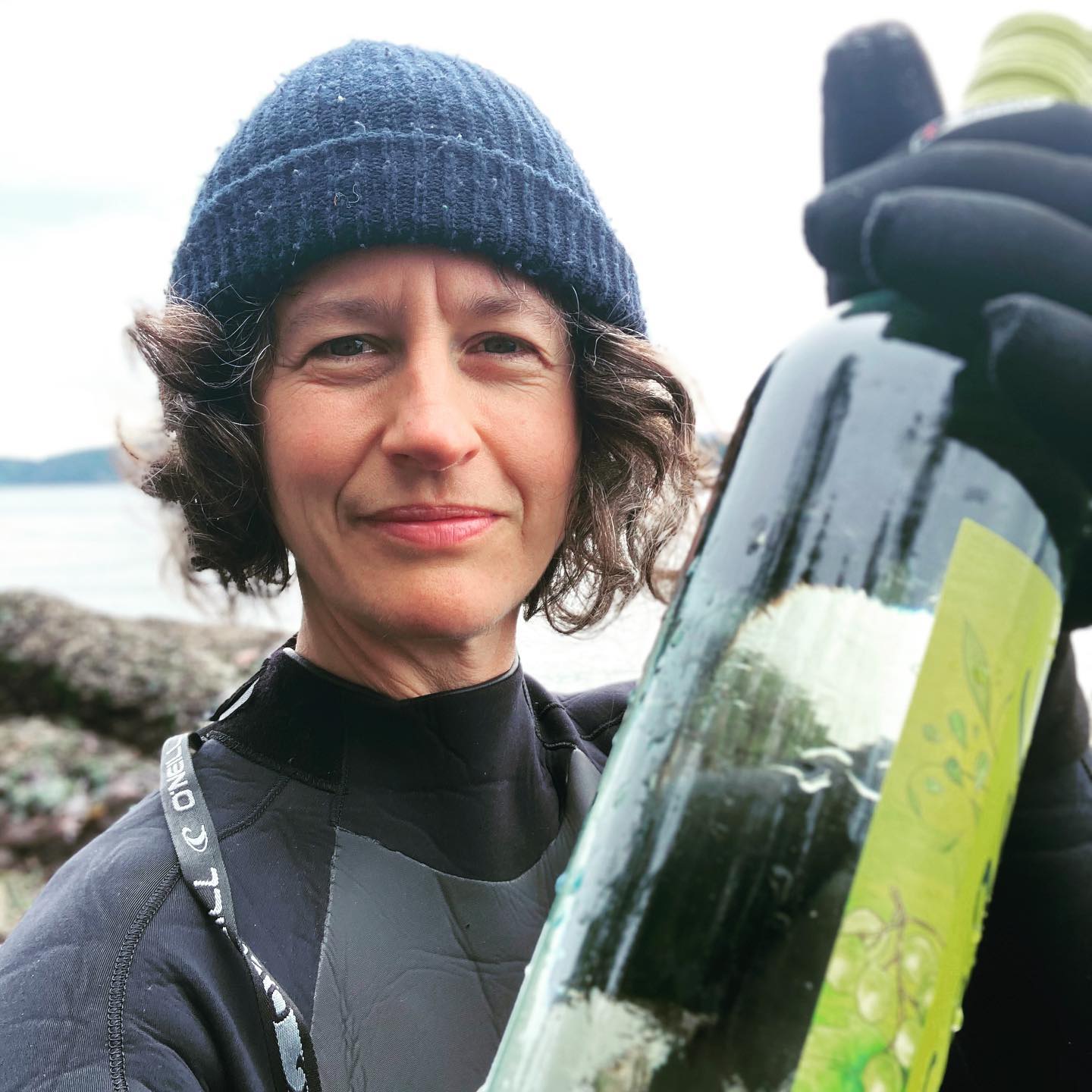 a boy wearing a hat and smiling at the camera