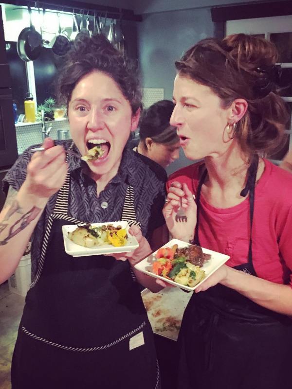 a couple of people that are eating some food