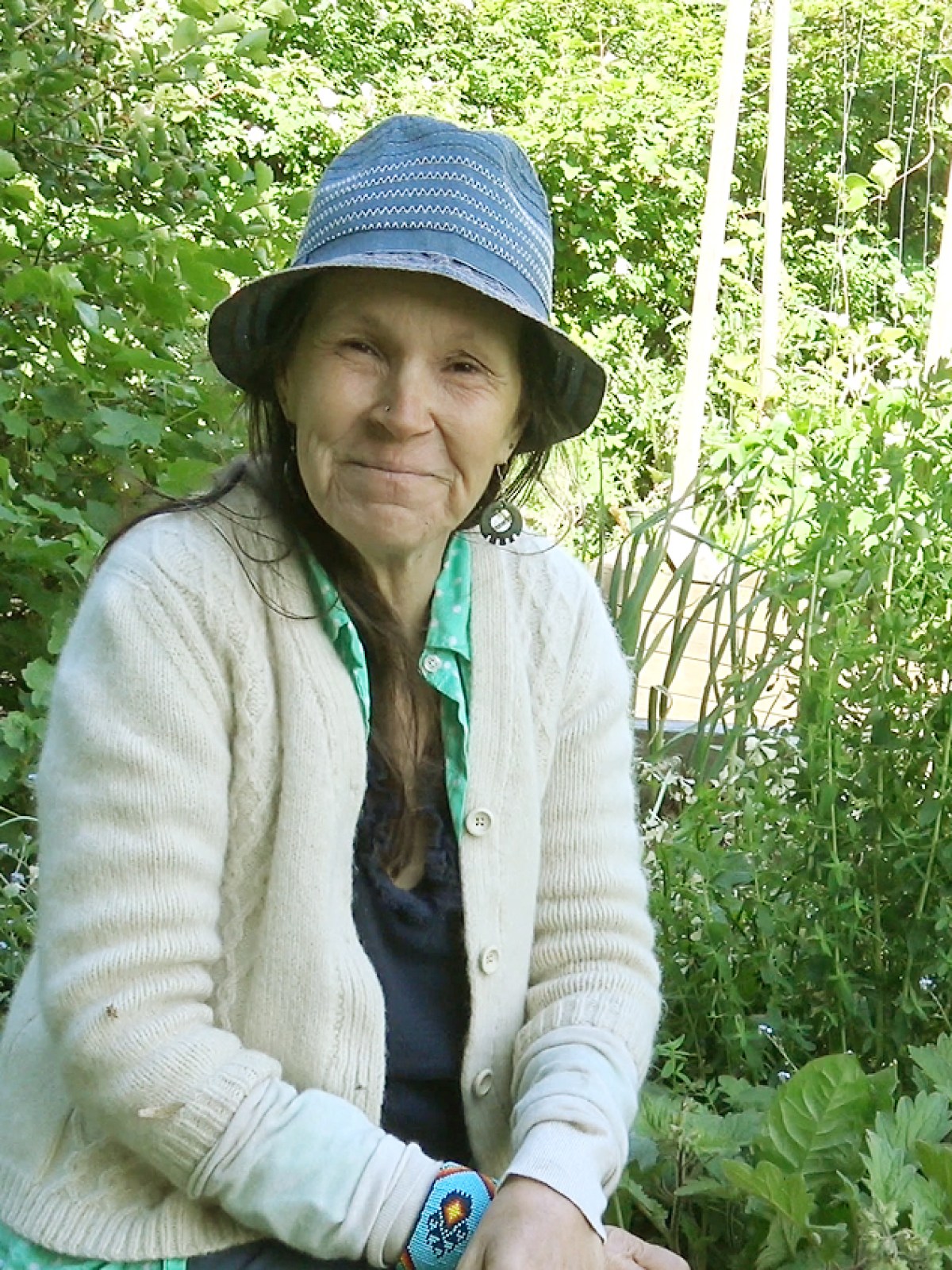 a little girl standing in a garden