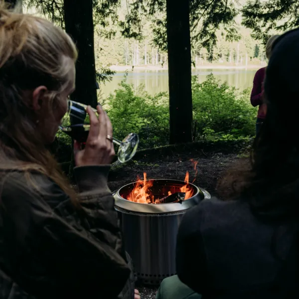 a woman holding a glass of wine