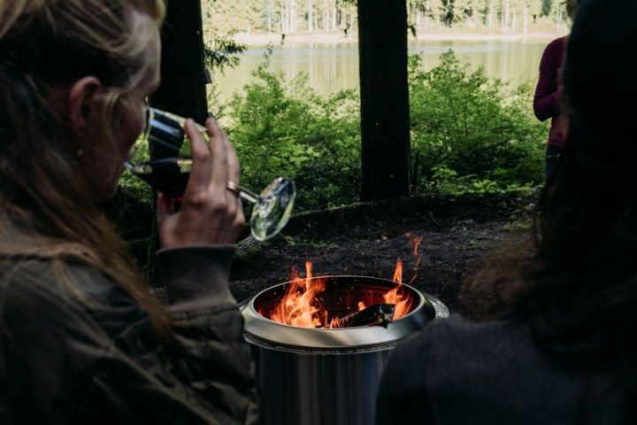 a woman holding a glass of wine