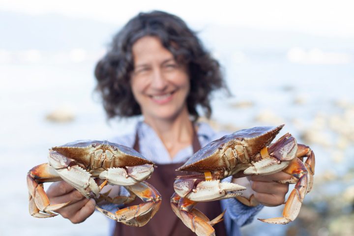 Chef Robin Kort holding a crab