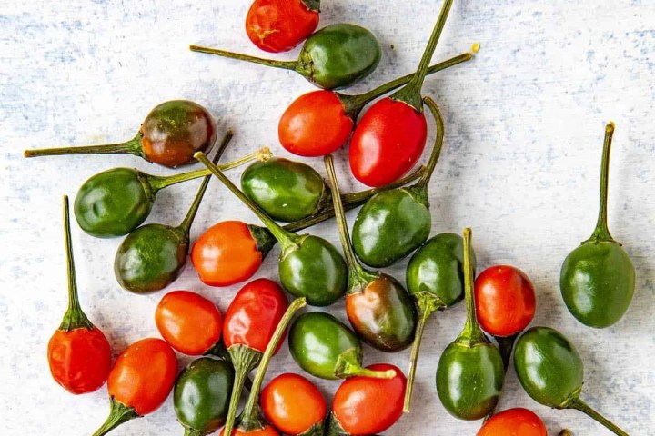 fresh fruit and vegetables on a cutting board