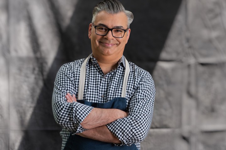 Bruno Feldeisen wearing glasses and smiling at the camera